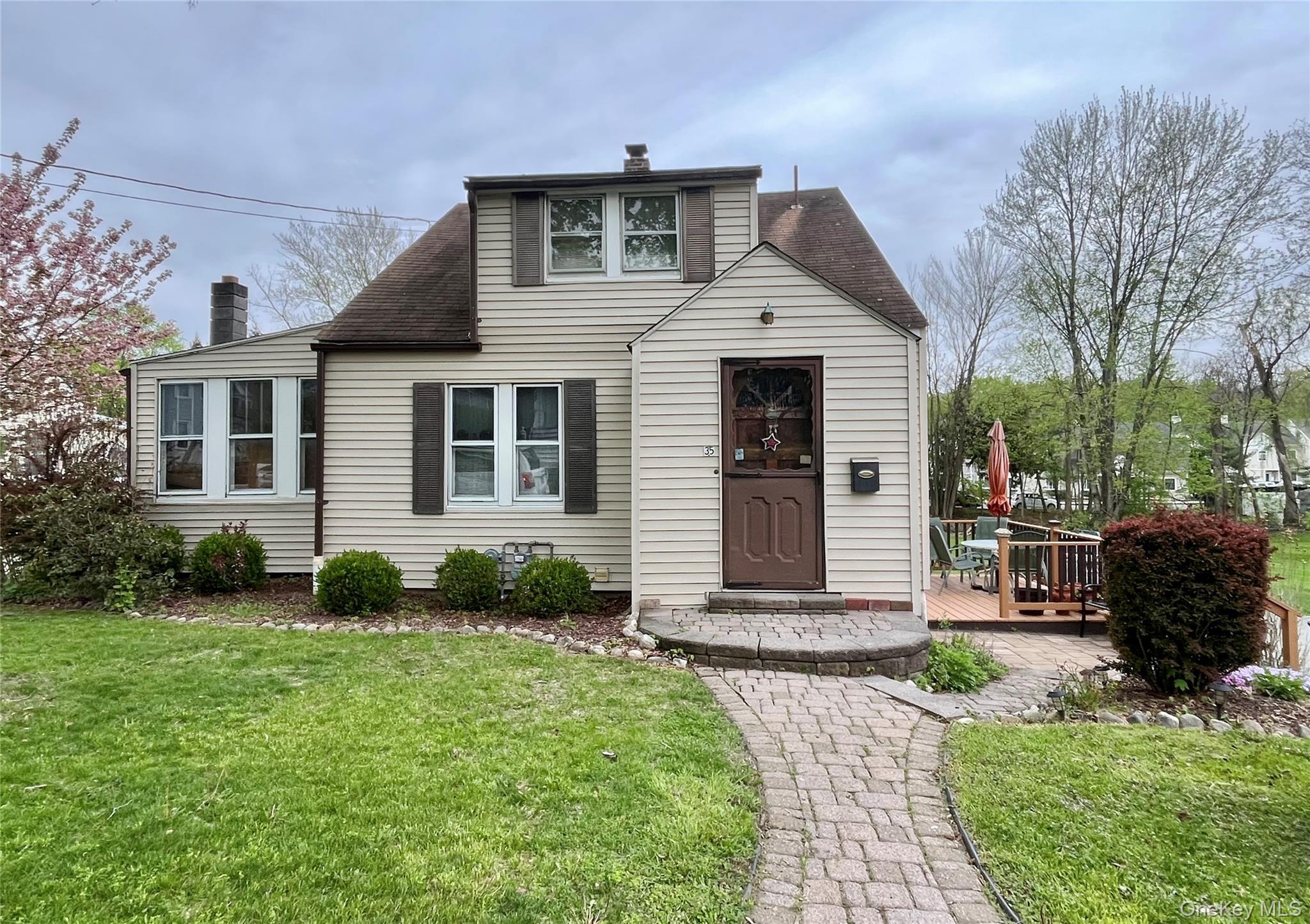 35 Spring Street Goshen, NY 10924 - Photo 1 of 26 a front view of a house with garden