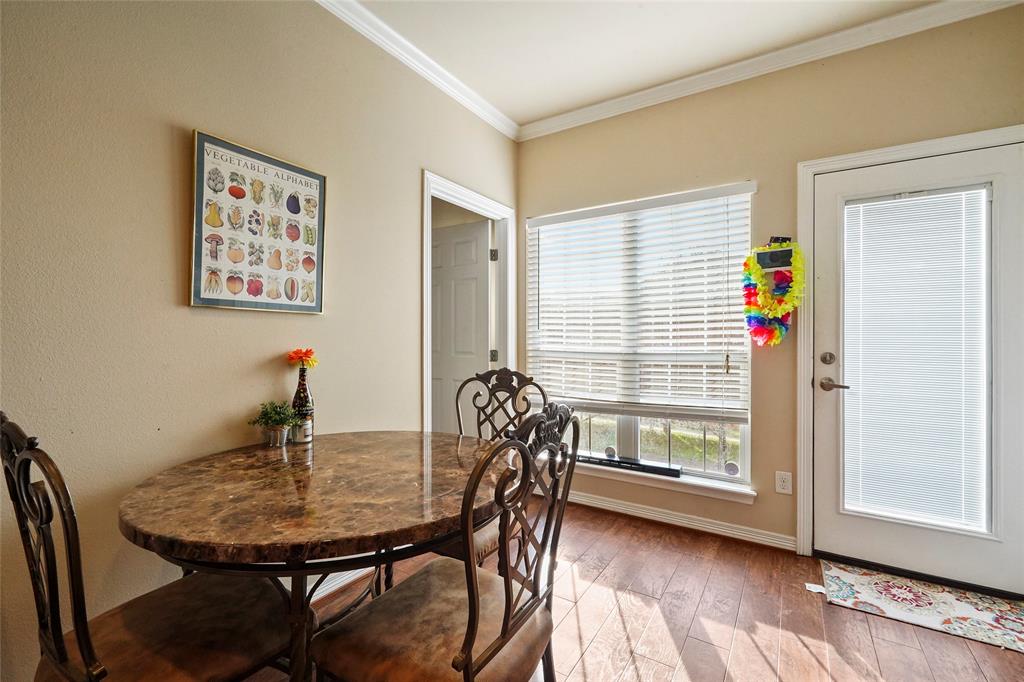 1198 Jones-Butler Road, Unit 203 College Station, TX 77840 - Photo 7 of 18 Dining area with ornamental molding and hardwood / wood-style flooring