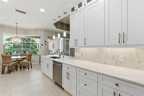 a kitchen with a sink and cabinets