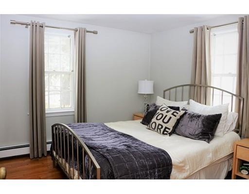 8 Merrymount Road Hingham, MA 02043 - Photo 8 of 16 a bedroom with a bed and a window