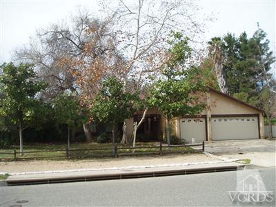 49 Wrangler Road Simi Valley, CA 93065 - Photo 14 of 21 a view of a house with a yard and large tree