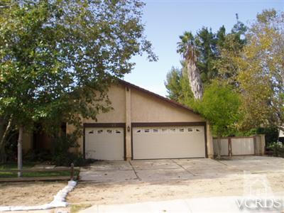 49 Wrangler Road Simi Valley, CA 93065 - Photo 3 of 21 a white house that has tree in front of it