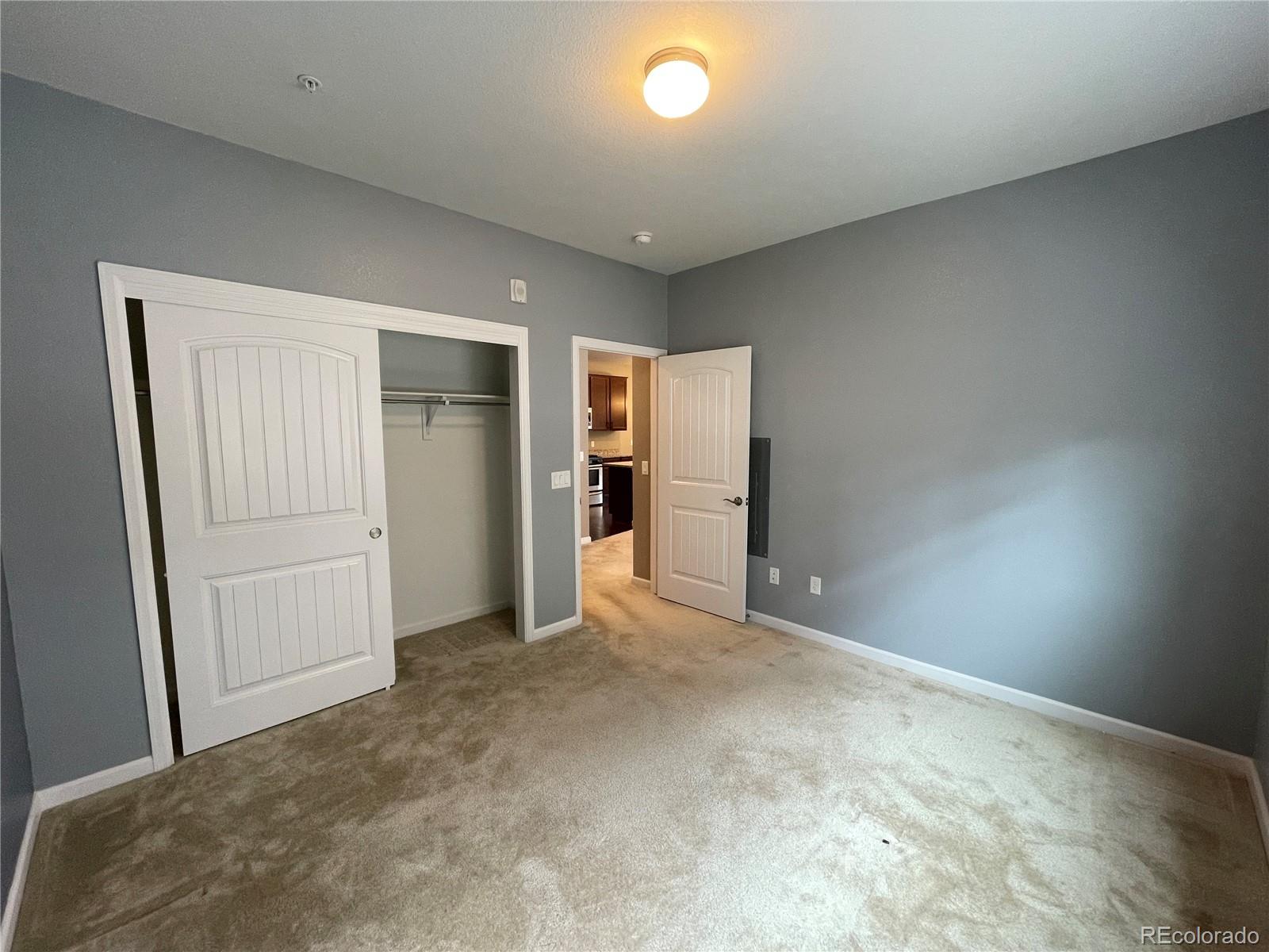 4604 Copeland Circle, Unit 103 Highlands Ranch, CO 80126 - Photo 11 of 11 an empty room with closet and a window