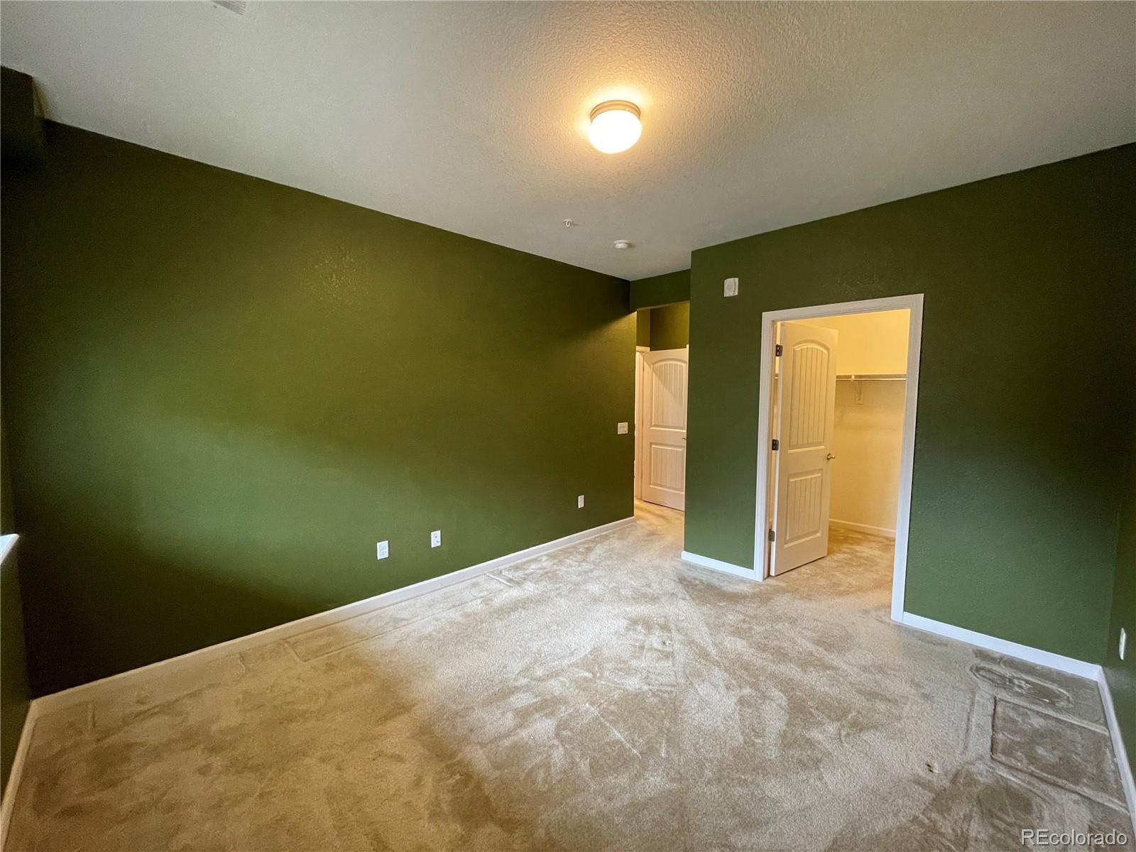 4604 Copeland Circle, Unit 103 Highlands Ranch, CO 80126 - Photo 6 of 11 a view of an empty room with a window