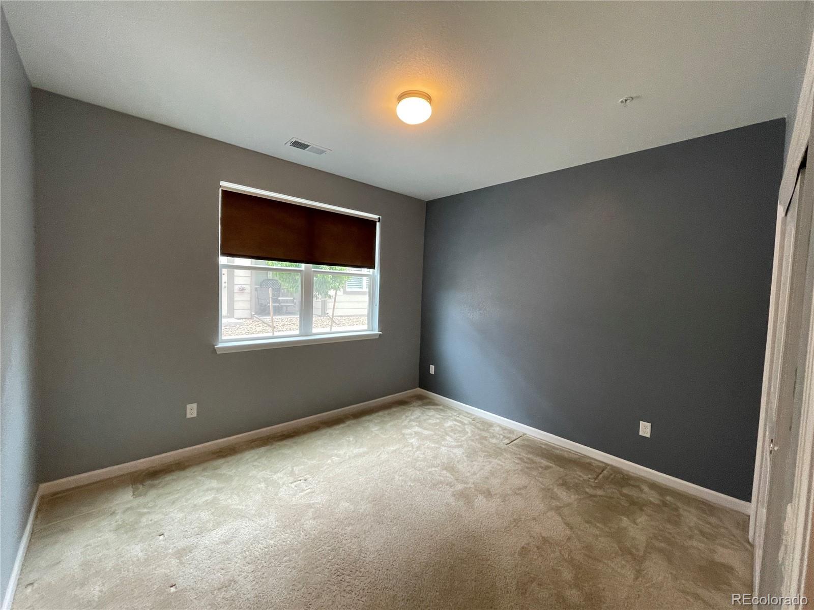 4604 Copeland Circle, Unit 103 Highlands Ranch, CO 80126 - Photo 9 of 11 an empty room with a window
