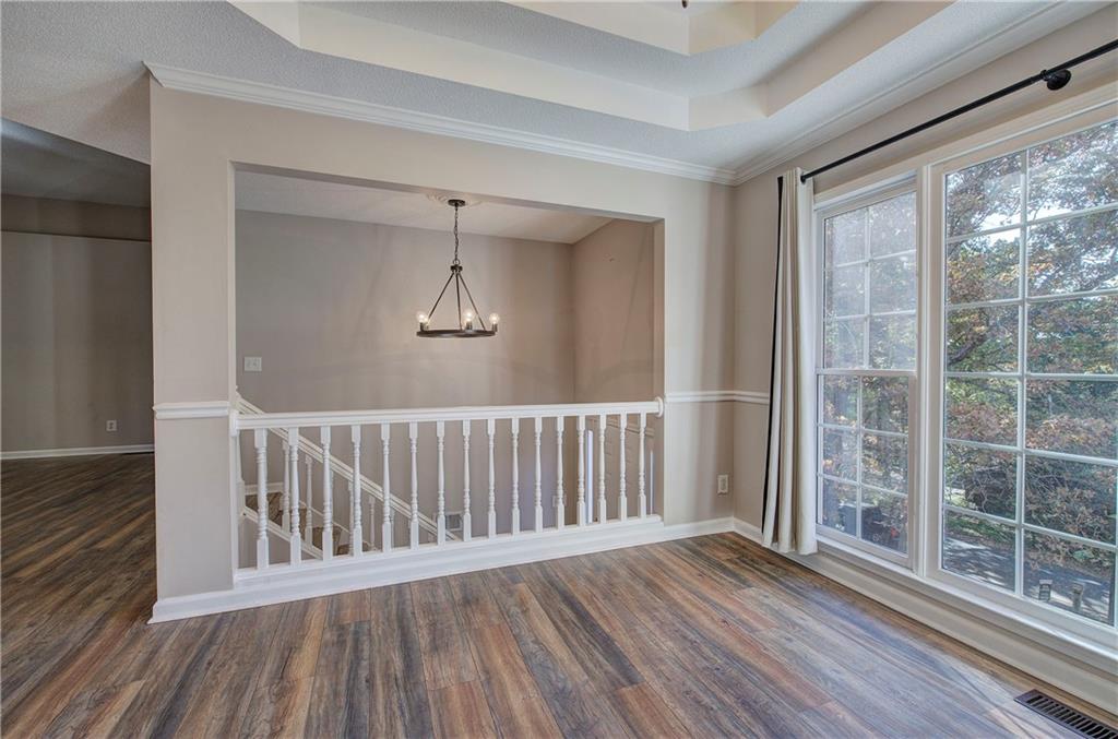 15 Roving Hills Circle Cartersville, GA 30121 - Photo 12 of 55 a view of a room with wooden floor wooden floor and windows