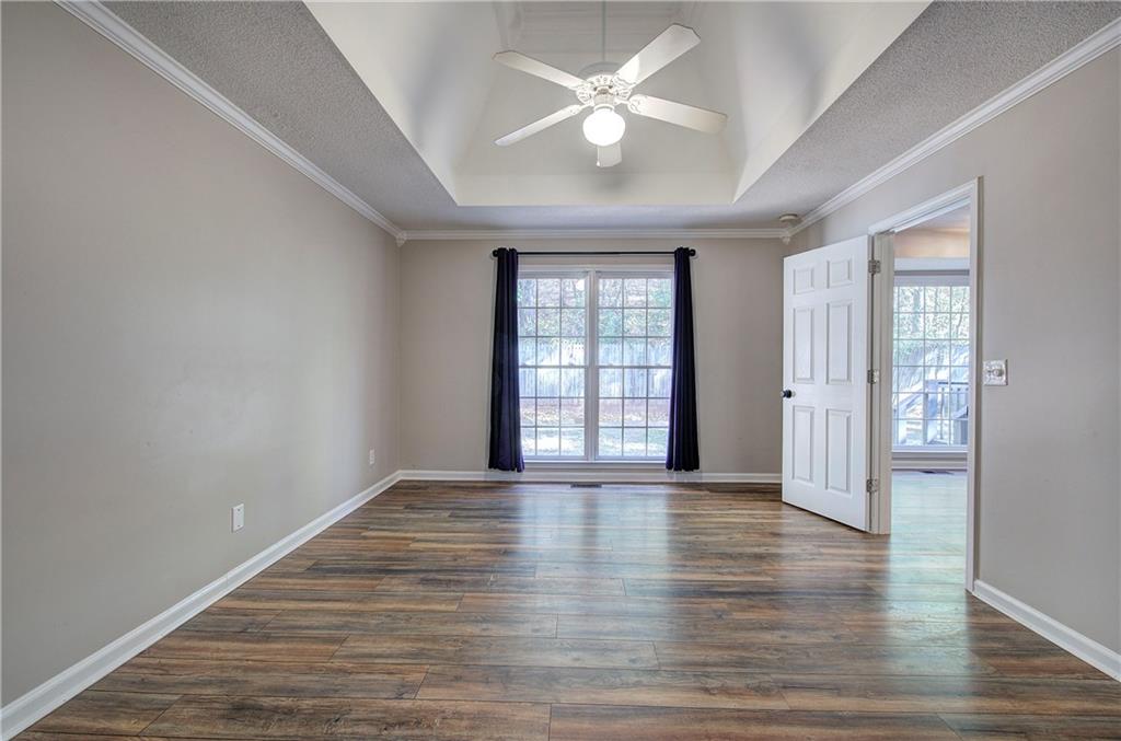 15 Roving Hills Circle Cartersville, GA 30121 - Photo 22 of 55 wooden floor in an empty room with a window