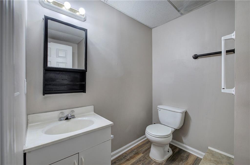 15 Roving Hills Circle Cartersville, GA 30121 - Photo 43 of 55 a bathroom with a toilet sink and mirror