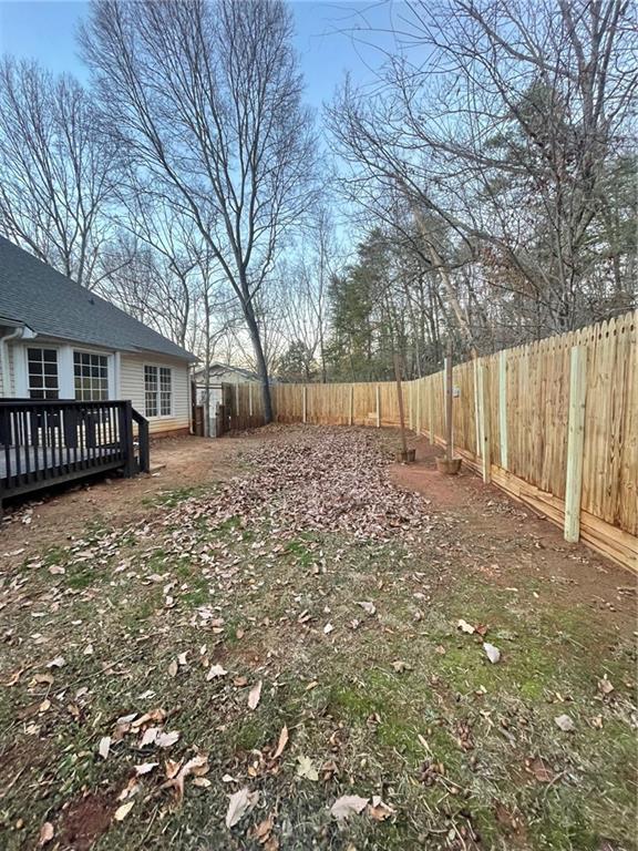 15 Roving Hills Circle Cartersville, GA 30121 - Photo 50 of 55 a view of a yard with wooden fence