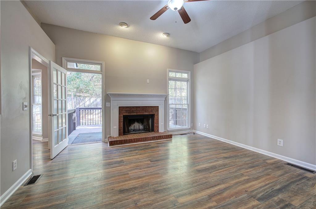 15 Roving Hills Circle Cartersville, GA 30121 - Photo 5 of 55 wooden floor fireplace and natural light in room