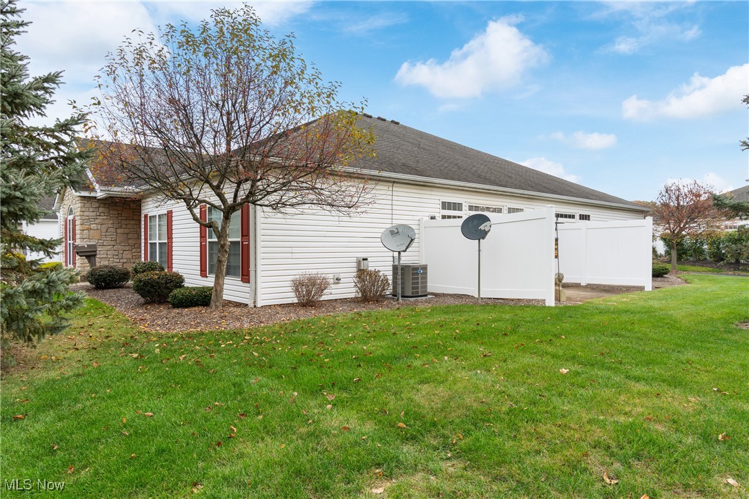 7030 Knight Avenue Northwest Canton, OH 44708 - Photo 25 of 26 View of home's exterior with a yard