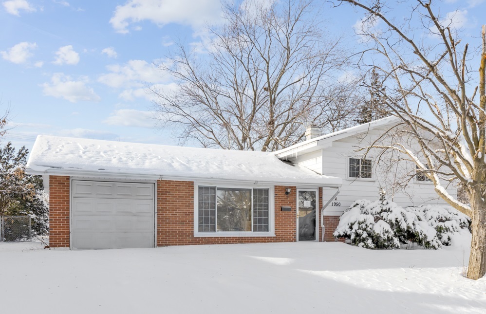 1950 Ashley Road Hoffman Estates, IL 60169 - Photo 1 of 19 a front view of a house with a garden