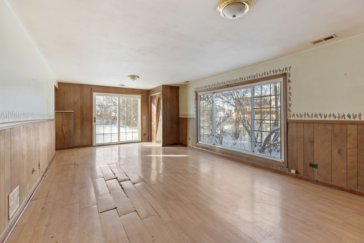 1950 Ashley Road Hoffman Estates, IL 60169 - Photo 14 of 19 a view of an empty room with wooden floor and a window