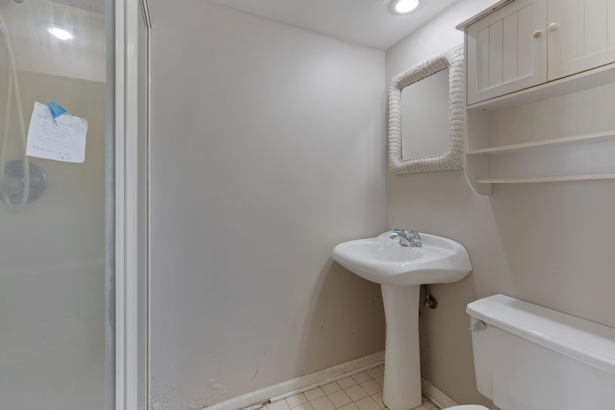 1950 Ashley Road Hoffman Estates, IL 60169 - Photo 15 of 19 a bathroom with a sink a toilet and shower