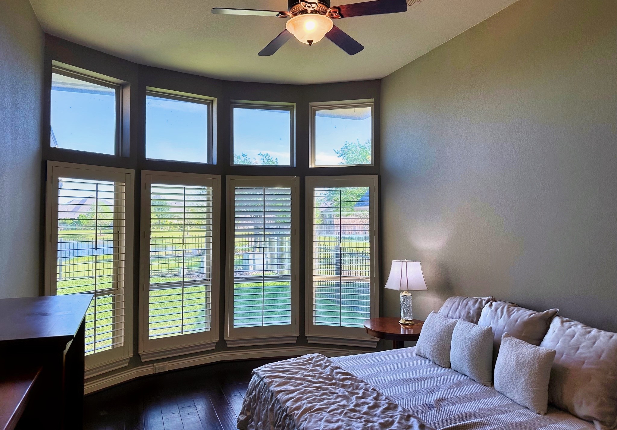 27838 Colonial Point Drive Katy, TX 77494 - Photo 11 of 28 Lightn filled primary bedroom with a wall of windows overlooking the back yard.