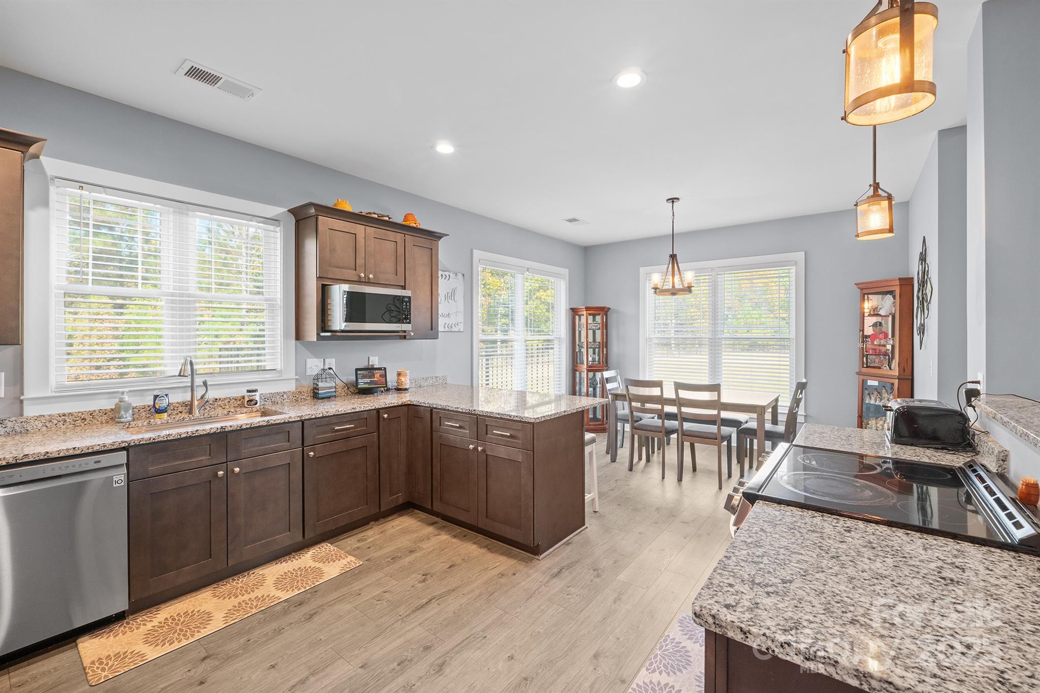 310 Stoneyard Road Richfield, NC 28137 - Photo 17 of 36 a kitchen with lots of counter top space and dining table