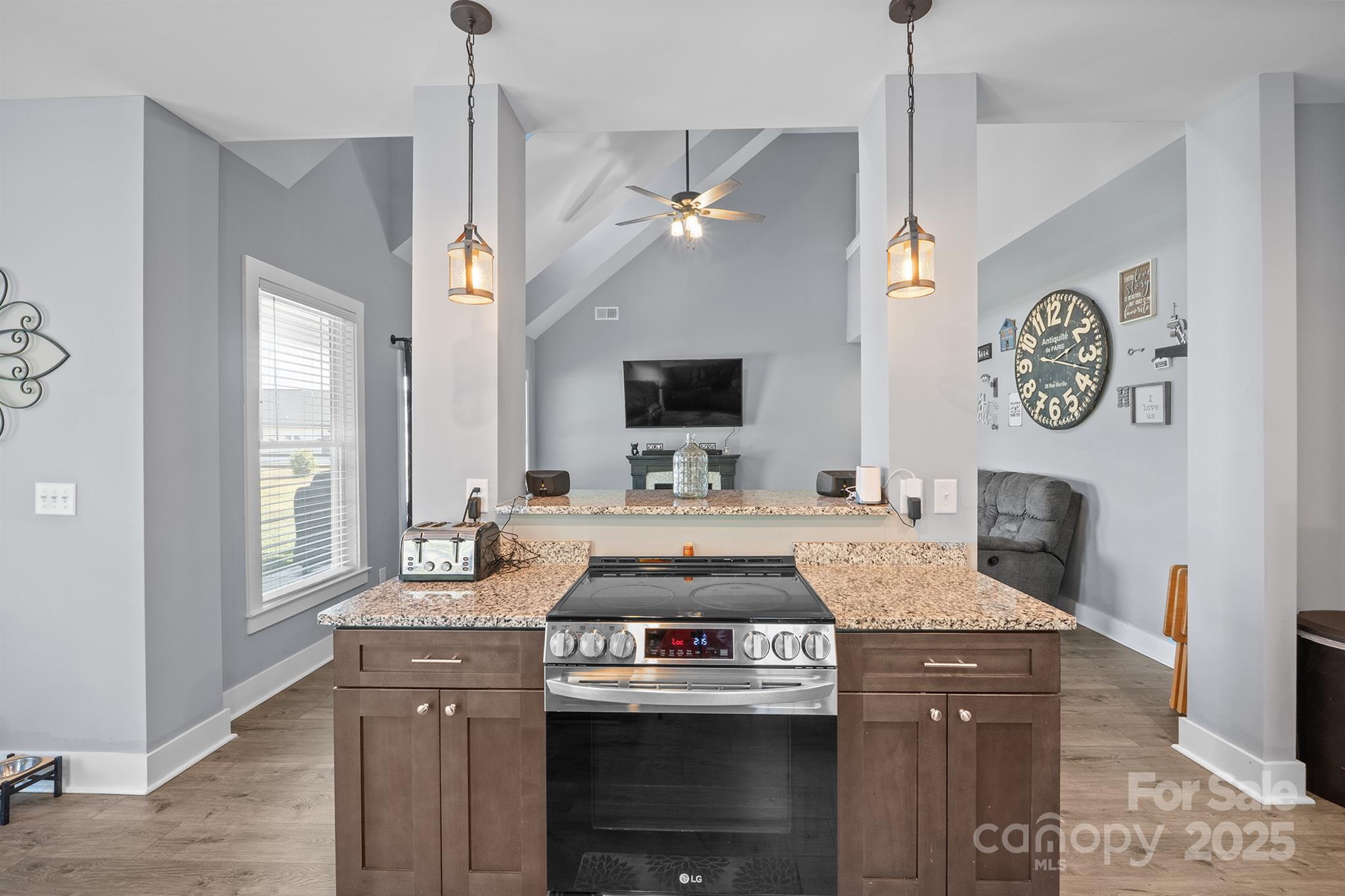 310 Stoneyard Road Richfield, NC 28137 - Photo 18 of 36 a kitchen with a stove and a chandelier