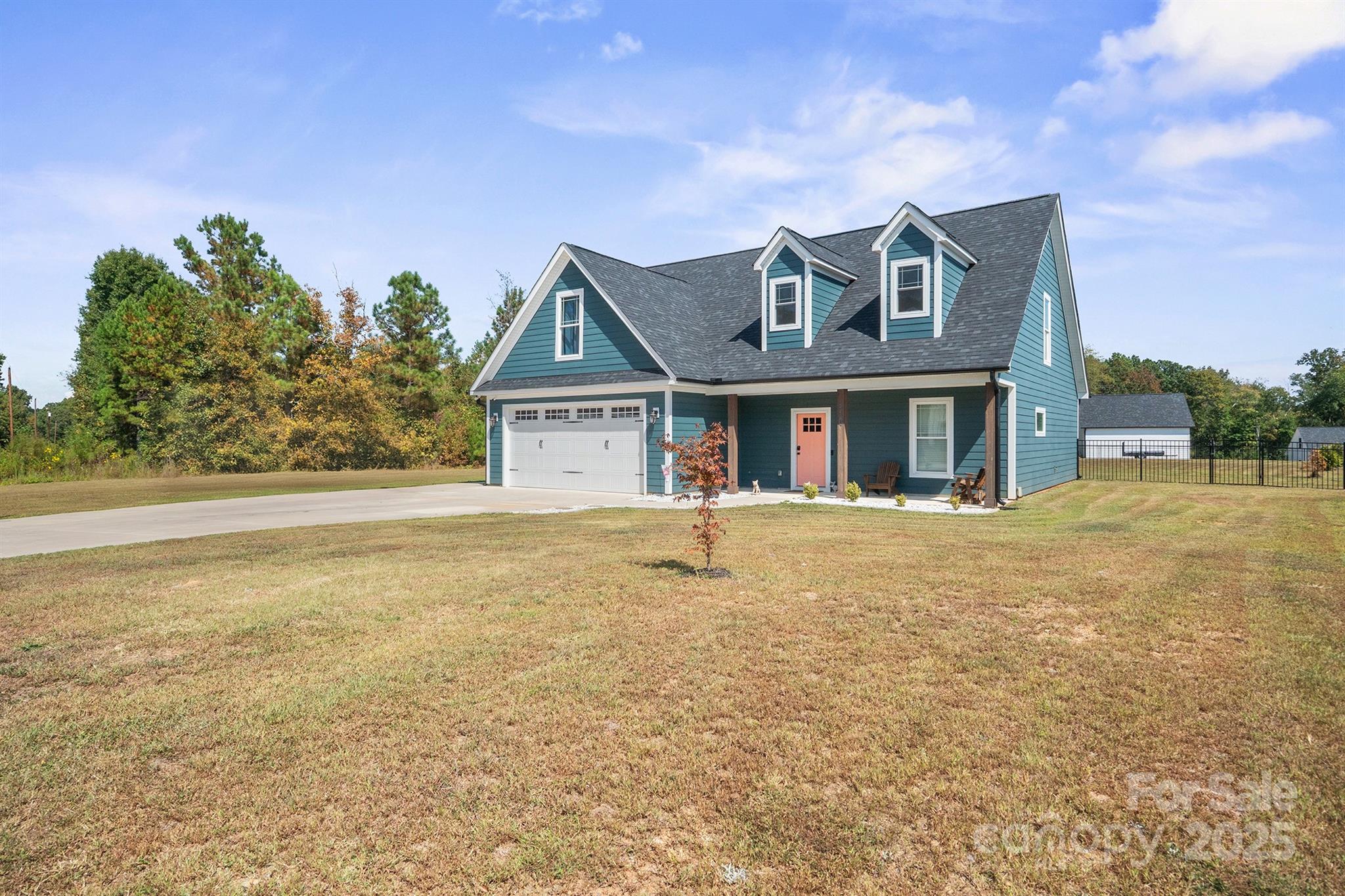 310 Stoneyard Road Richfield, NC 28137 - Photo 2 of 36 a view of a white house next to a yard with big trees