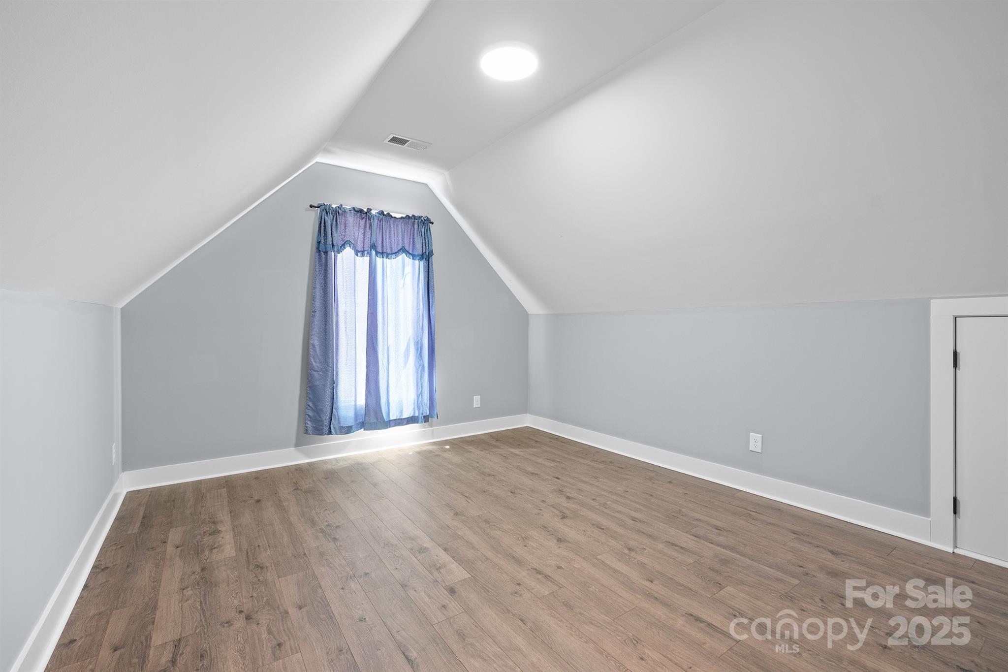 310 Stoneyard Road Richfield, NC 28137 - Photo 22 of 36 wooden floor in an empty room with a window