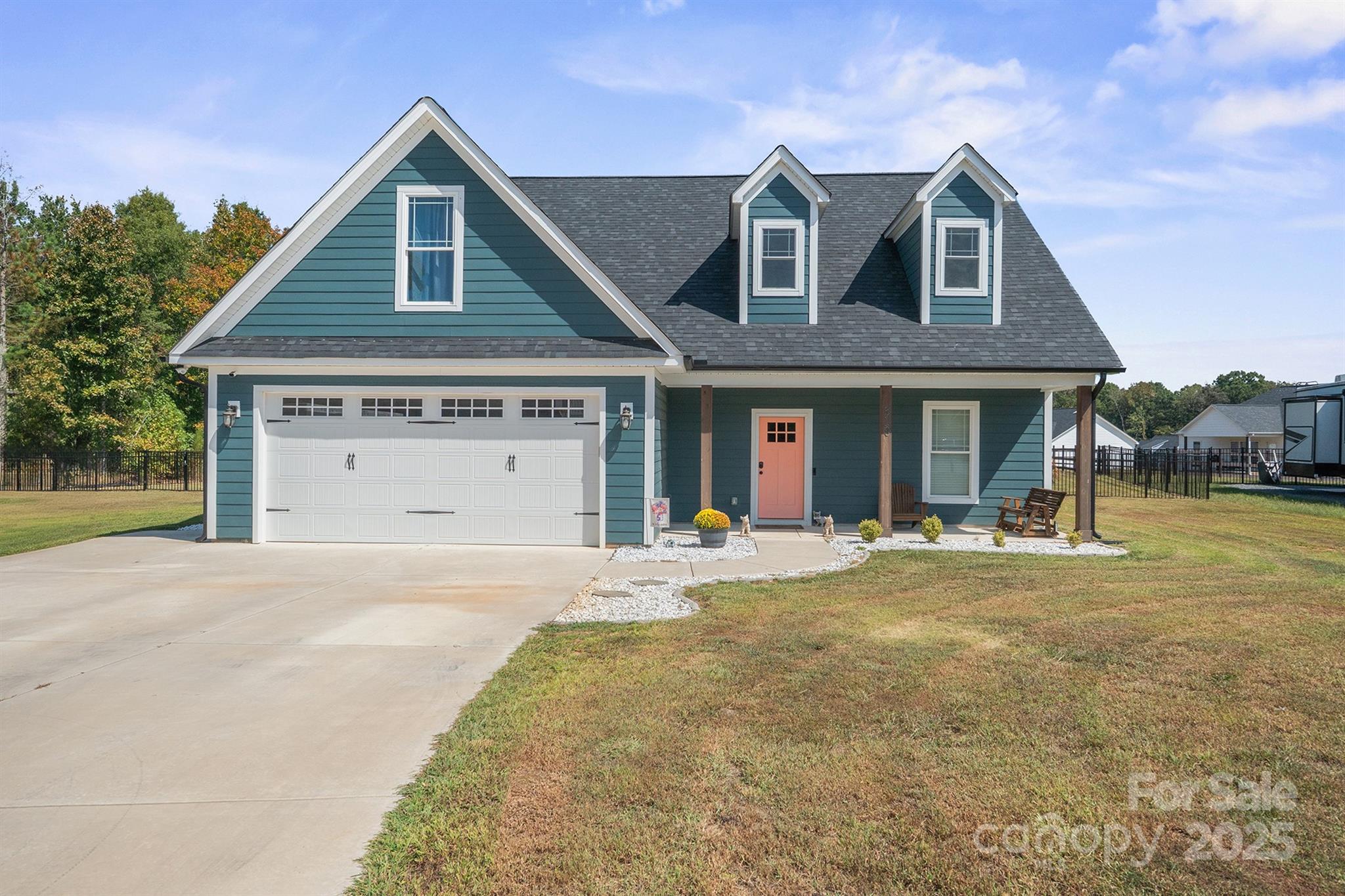 310 Stoneyard Road Richfield, NC 28137 - Photo 3 of 36 a front view of a house with a yard and garage