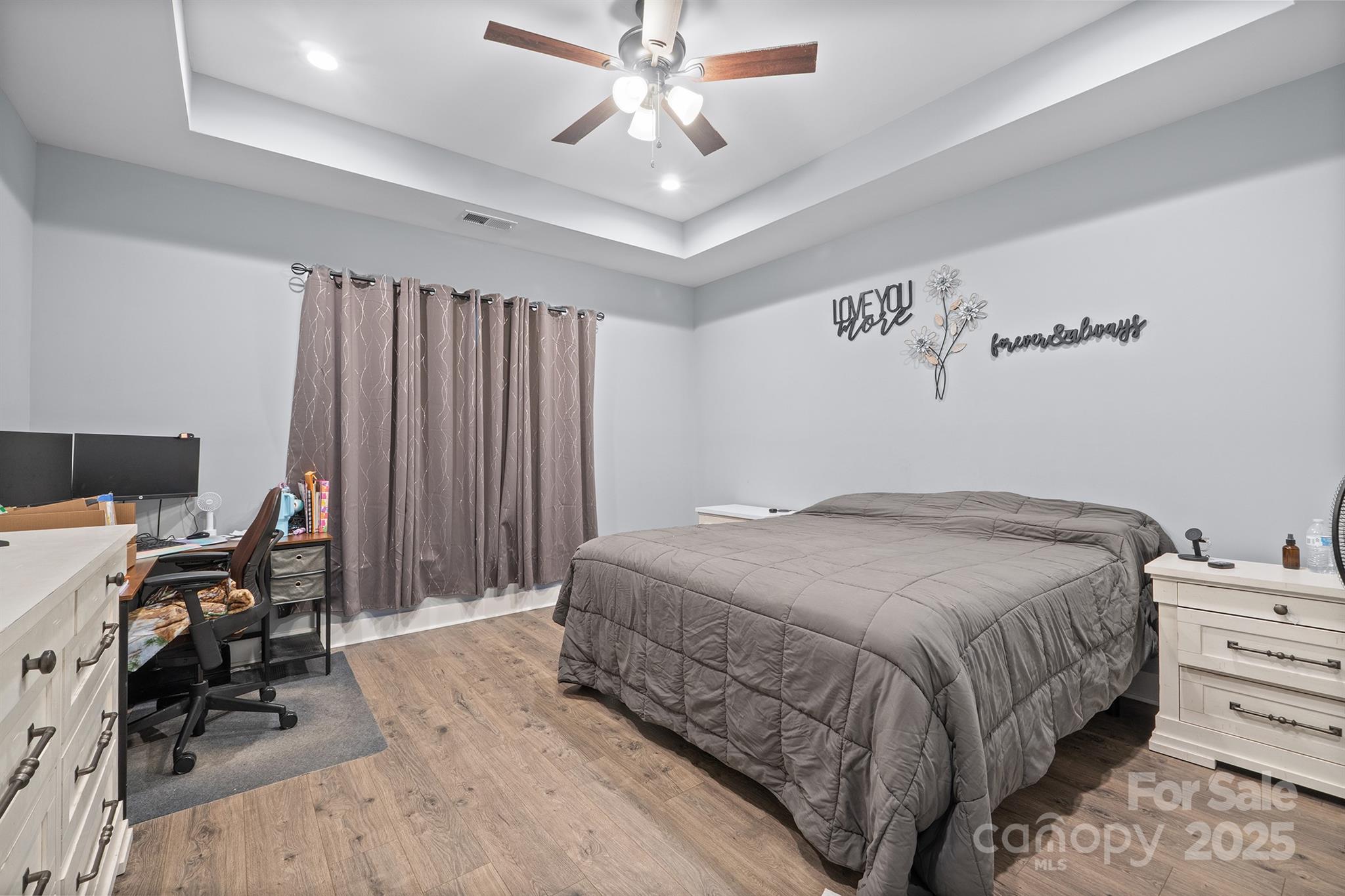 310 Stoneyard Road Richfield, NC 28137 - Photo 6 of 36 a bedroom with a bed dresser and a chandelier