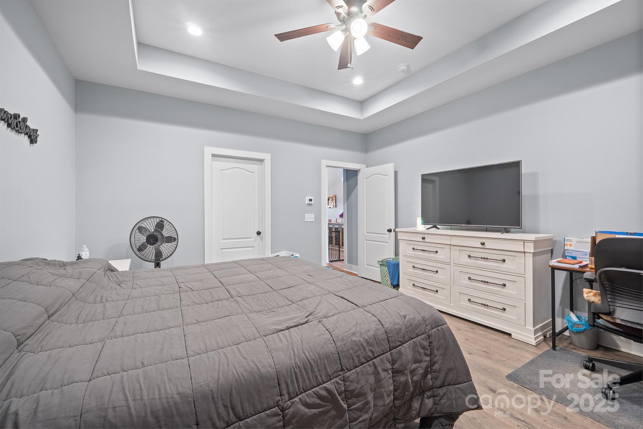 310 Stoneyard Road Richfield, NC 28137 - Photo 7 of 36 a bedroom with a bed and a flat screen tv