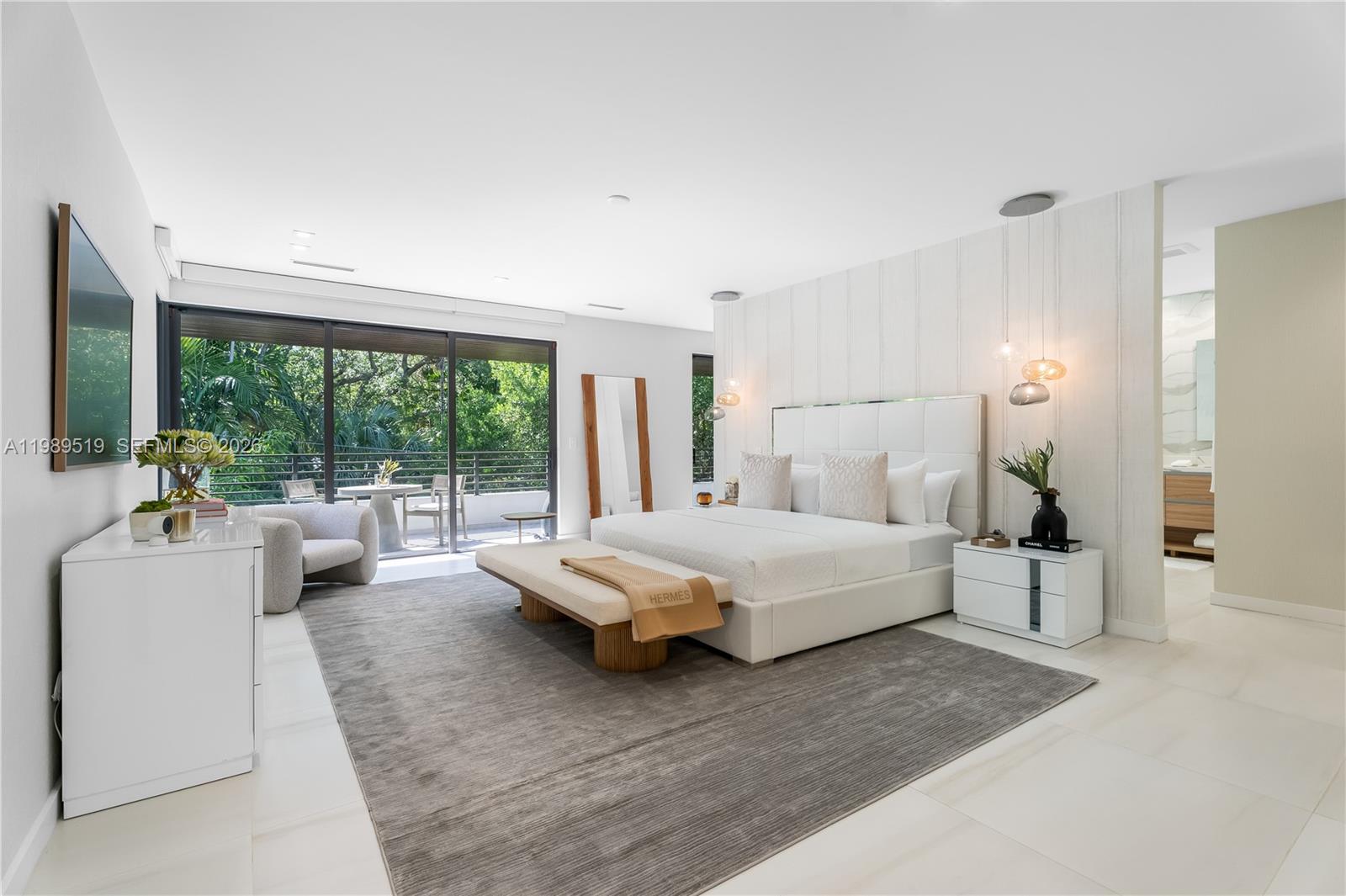 7900 Southwest 57th Court South Miami, FL 33143 - Photo 13 of 55 a bedroom with a large bed and a large window