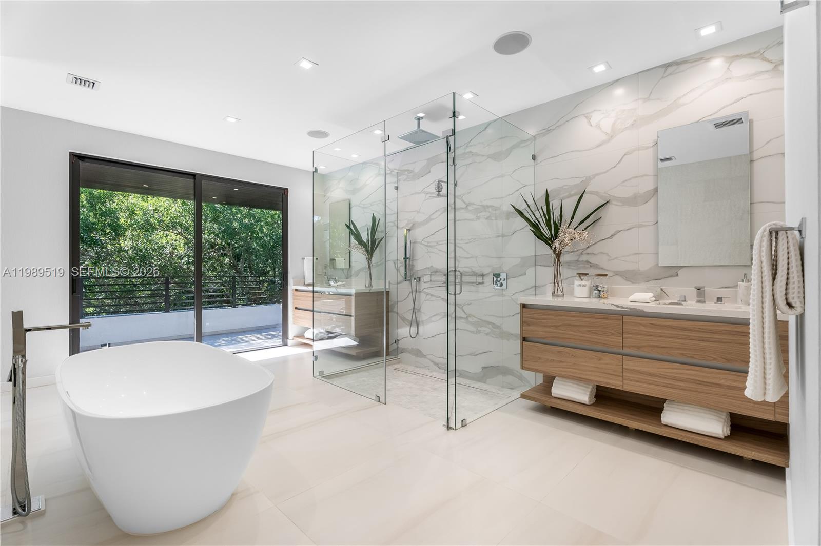 7900 Southwest 57th Court South Miami, FL 33143 - Photo 19 of 55 a bathroom with a large tub and shower