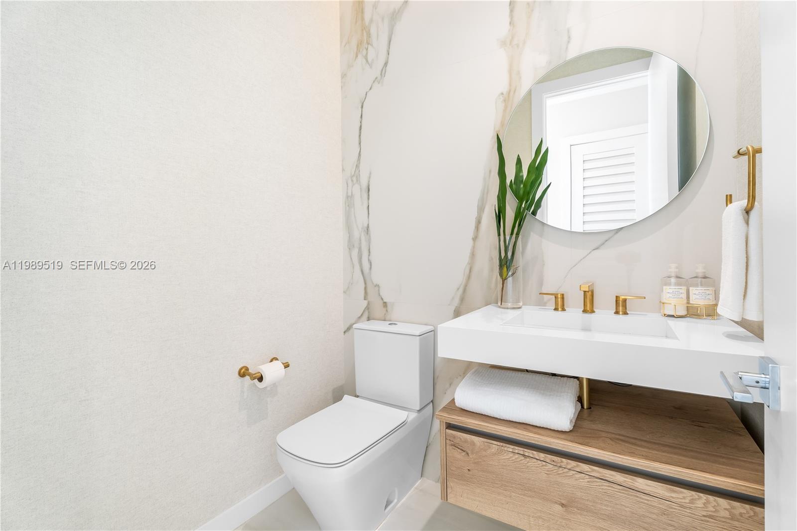 7900 Southwest 57th Court South Miami, FL 33143 - Photo 20 of 55 a bathroom with a sink toilet and mirror
