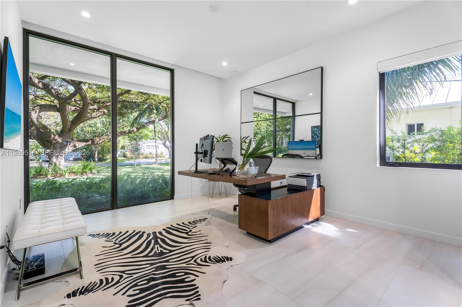 7900 Southwest 57th Court South Miami, FL 33143 - Photo 31 of 55 a living room with furniture and a large window