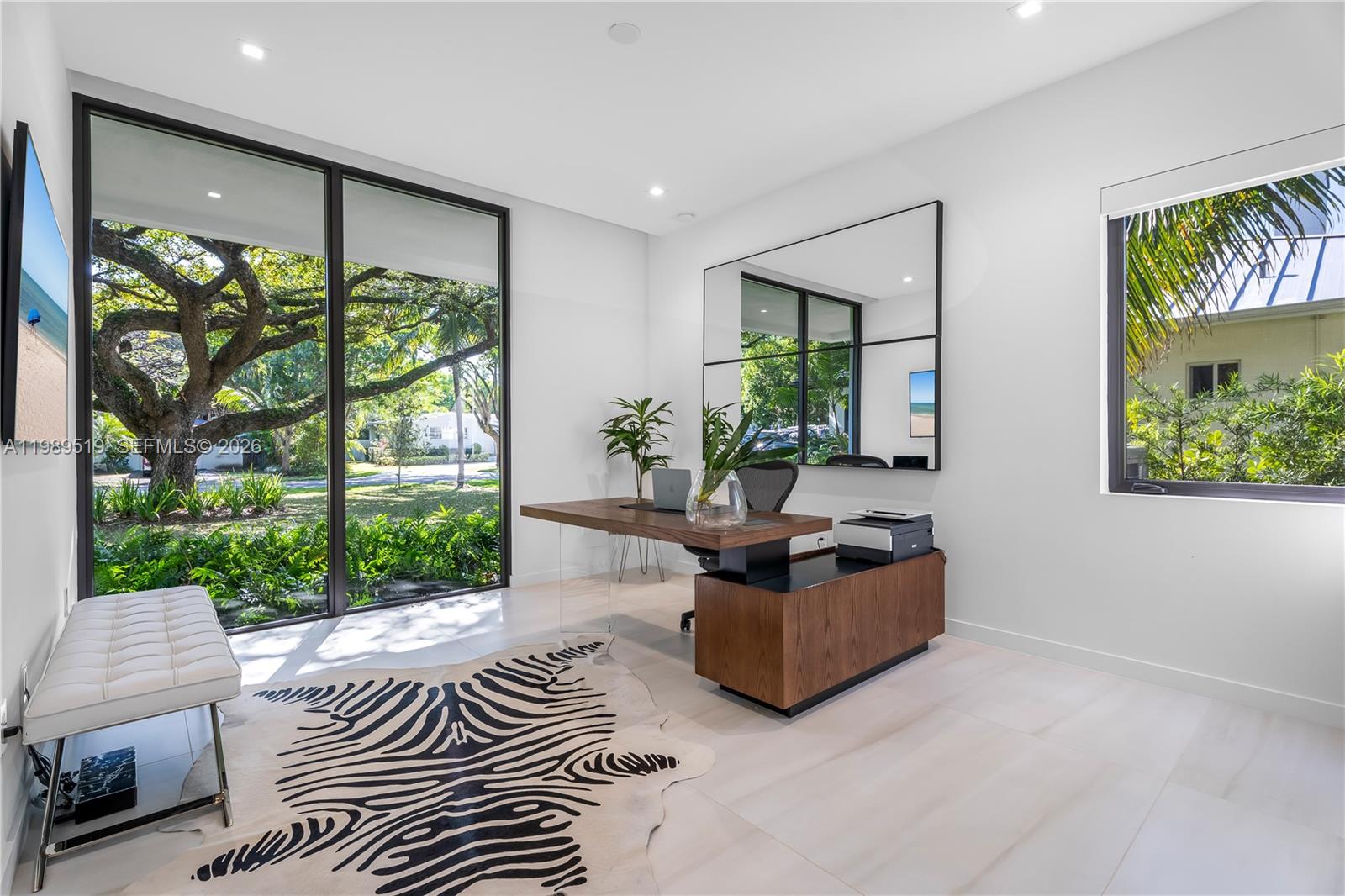 7900 Southwest 57th Court South Miami, FL 33143 - Photo 32 of 55 a living room with furniture and a large window