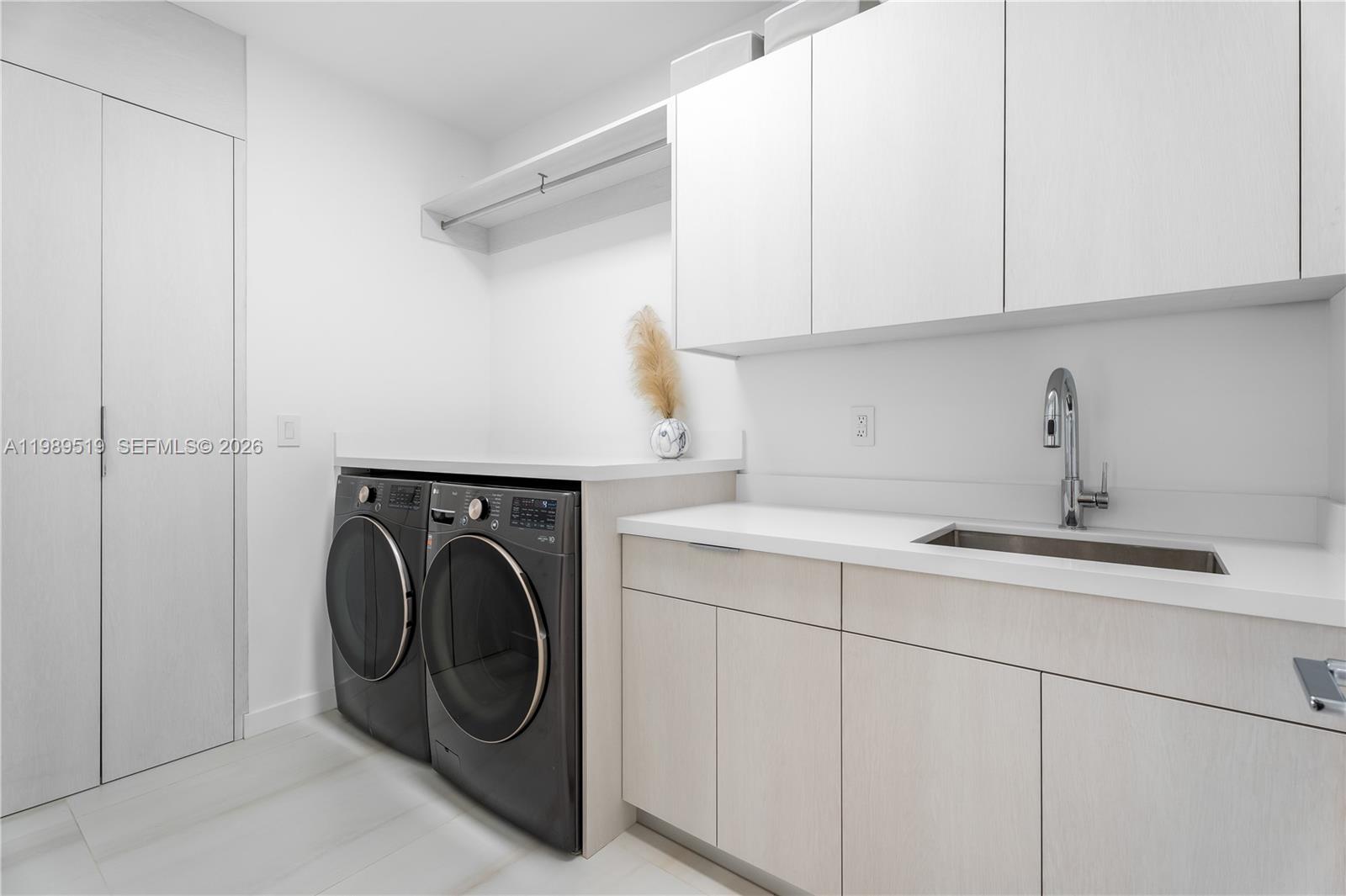 7900 Southwest 57th Court South Miami, FL 33143 - Photo 36 of 55 a utility room with sink dryer and washer