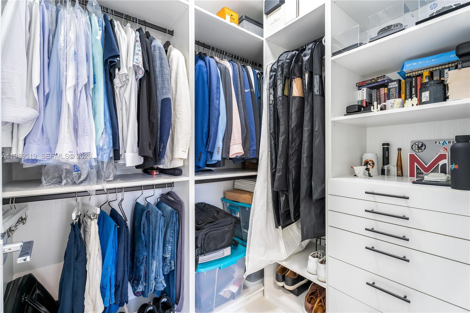 7900 Southwest 57th Court South Miami, FL 33143 - Photo 38 of 55 a view of walk in closet with clothes and shoes