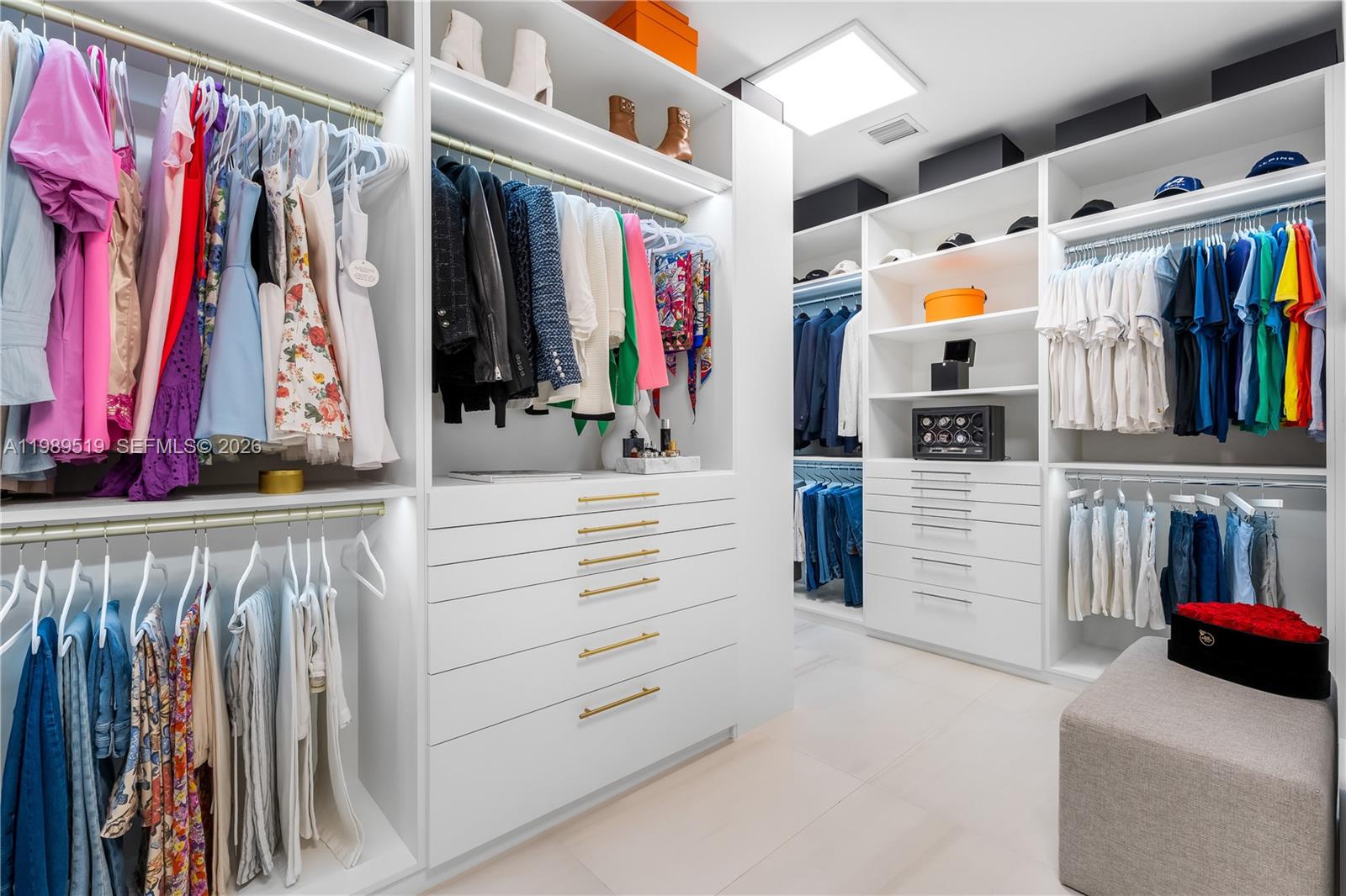 7900 Southwest 57th Court South Miami, FL 33143 - Photo 39 of 55 a view of walk in closet with clothes and shoes