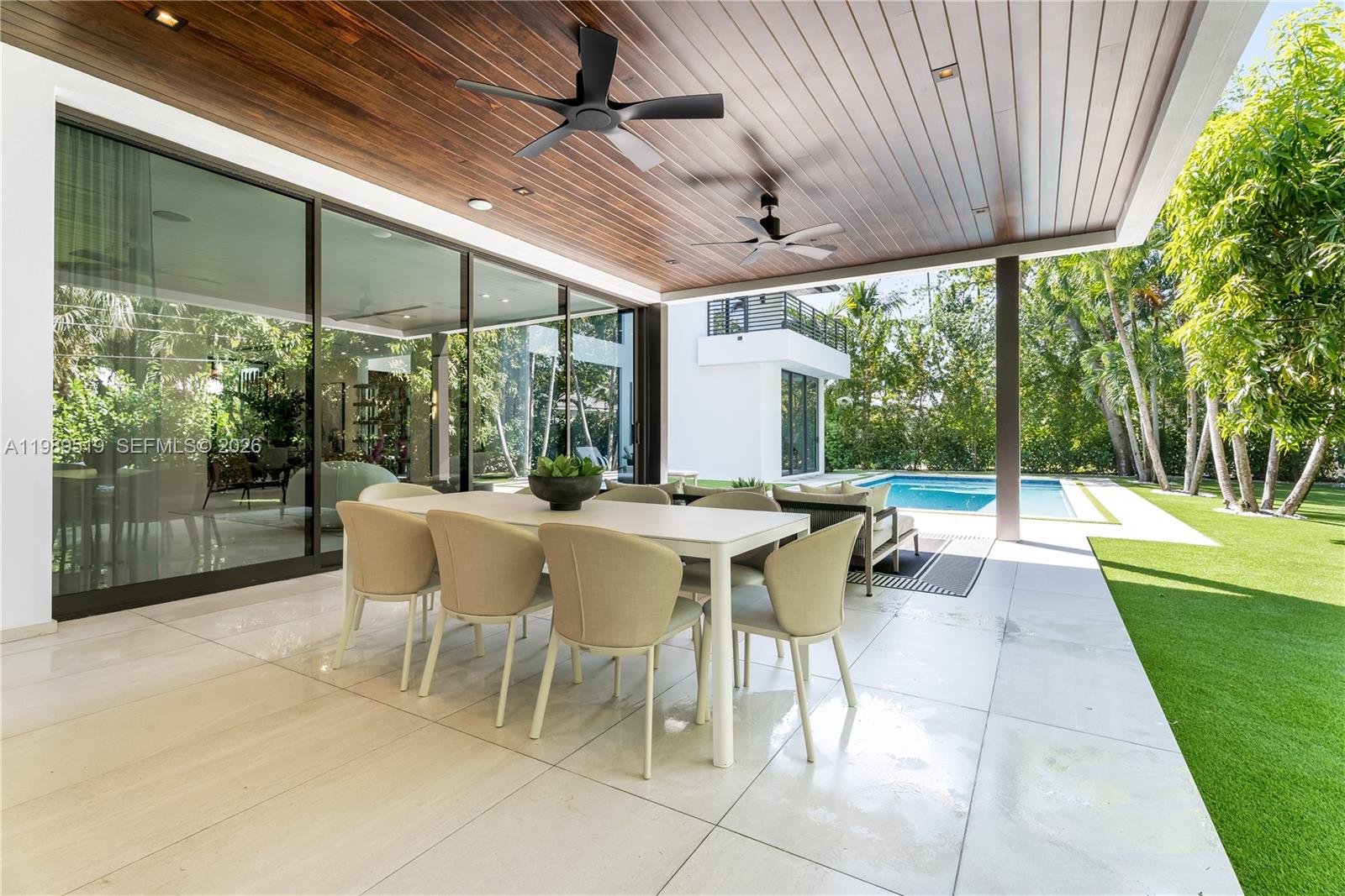 7900 Southwest 57th Court South Miami, FL 33143 - Photo 42 of 55 a view of a patio with a dining table and chairs