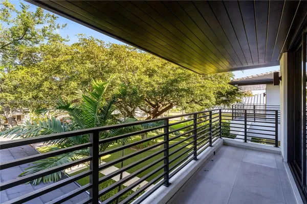 a view of a chair and table on the wooden deck