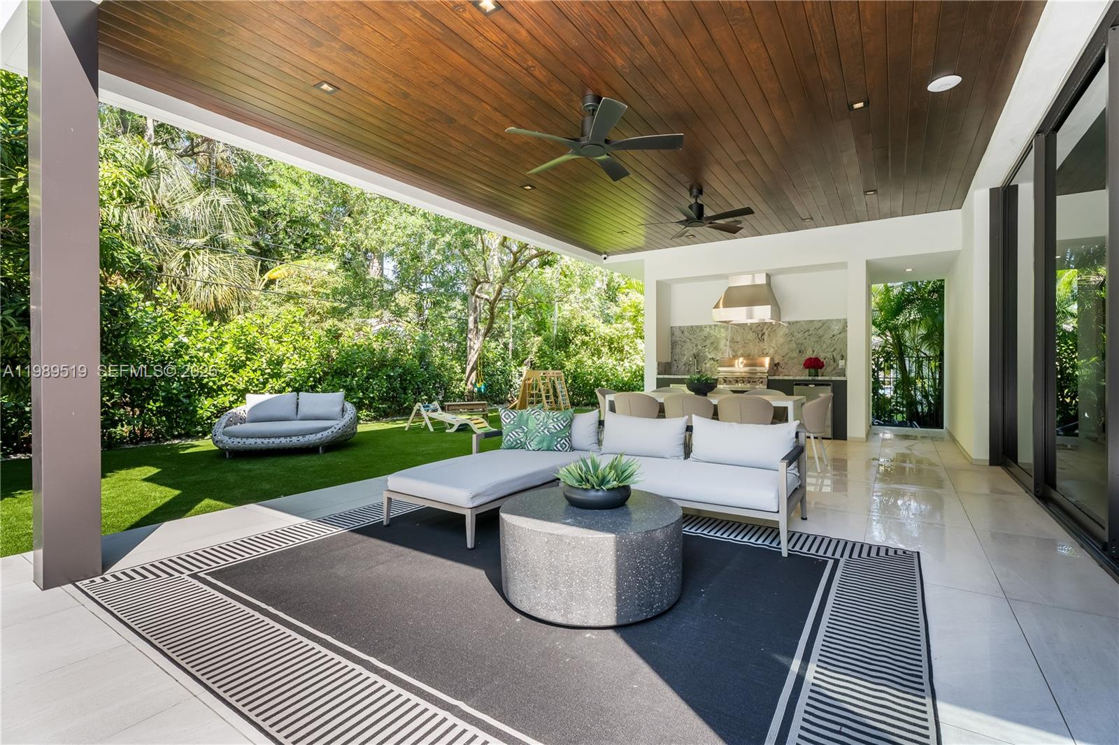 7900 Southwest 57th Court South Miami, FL 33143 - Photo 46 of 55 a patio with patio area and livingroom
