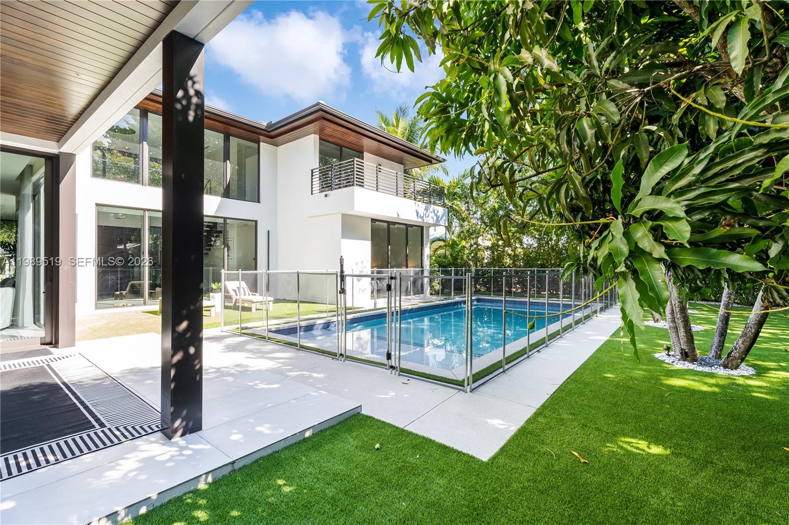7900 Southwest 57th Court South Miami, FL 33143 - Photo 49 of 55 a view of a house with backyard and porch