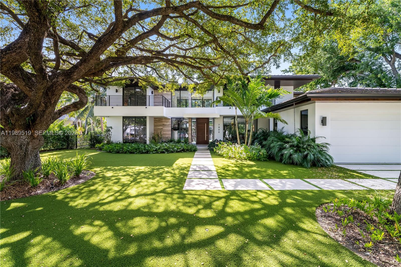 7900 Southwest 57th Court South Miami, FL 33143 - Photo 54 of 55 a front view of a house with a yard