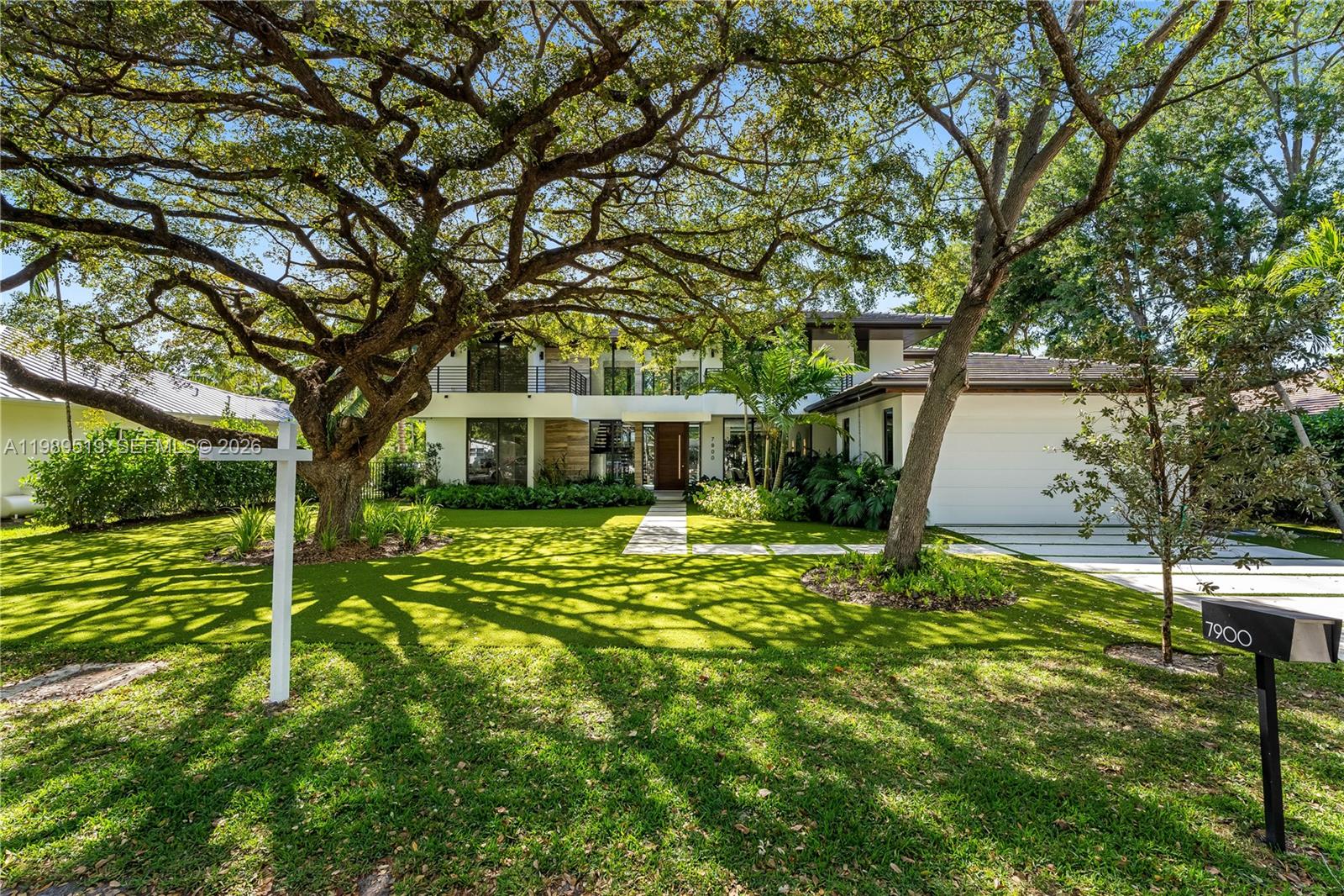 7900 Southwest 57th Court South Miami, FL 33143 - Photo 55 of 55 a front view of a house with a yard
