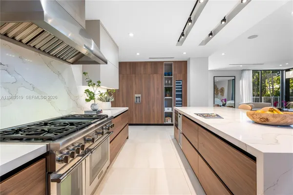 a kitchen with stove and cabinets