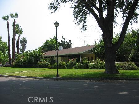 3624 Crowell Avenue Riverside, CA 92504 - Photo 1 of 1 a view of a park with plants and large trees
