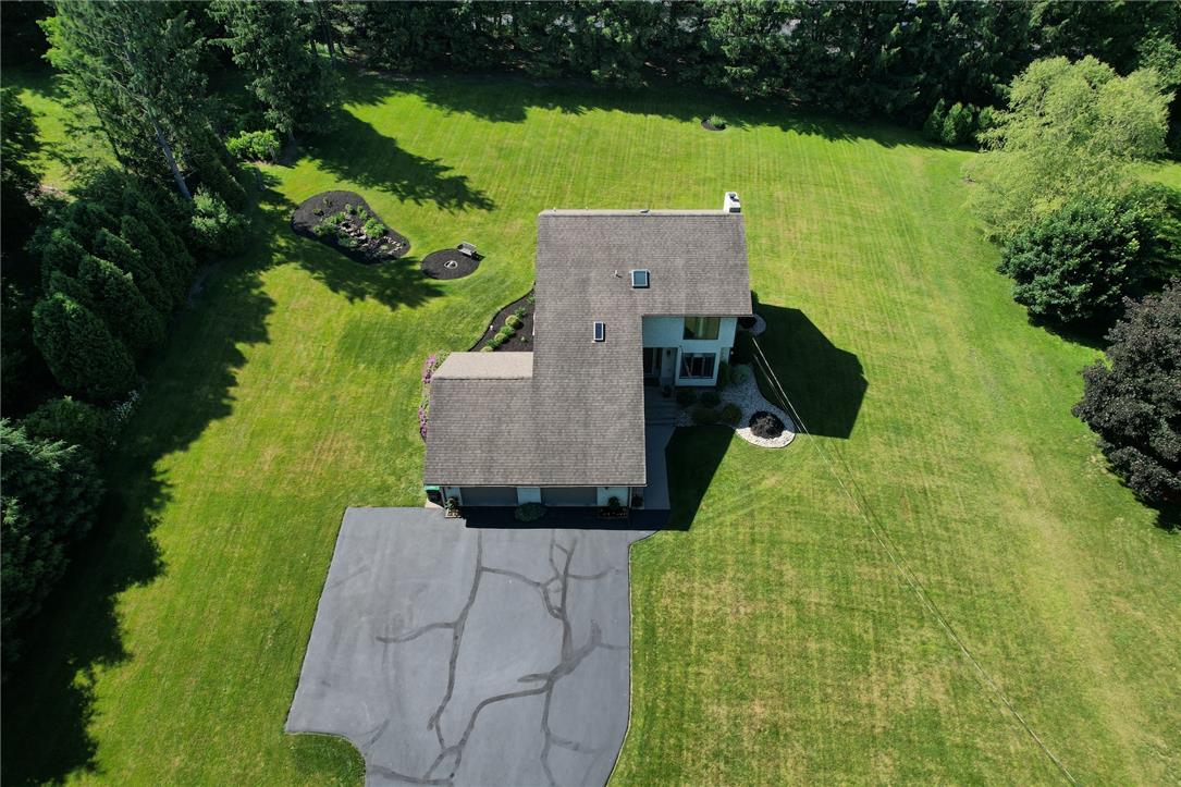 3470 Brodhead Road Bethlehem, PA 18020 - Photo 4 of 84 An aerial perspective reveals a home nestled within an expansive, verdant yard with mature trees.