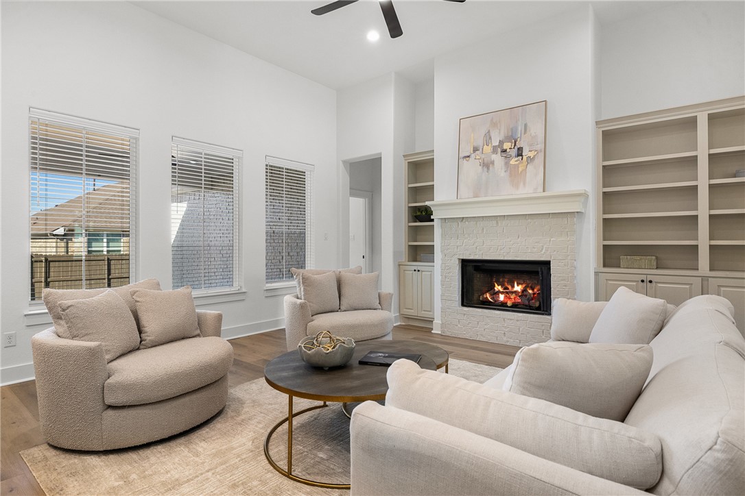 5020 Toscana Loop Bryan, TX 77802 - Photo 13 of 32 a living room with furniture and a fireplace