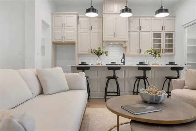 a view of kitchen with furniture and wooden floor