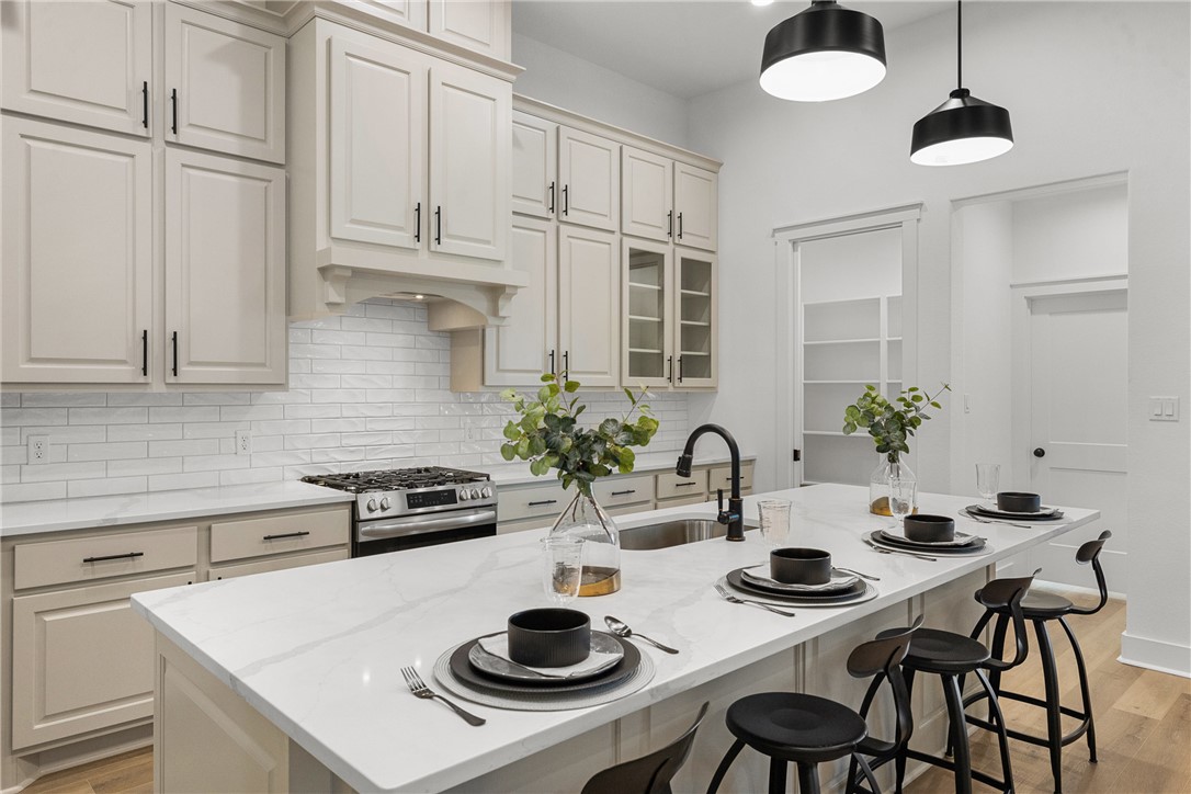 5020 Toscana Loop Bryan, TX 77802 - Photo 10 of 32 a kitchen with a table and chairs in it