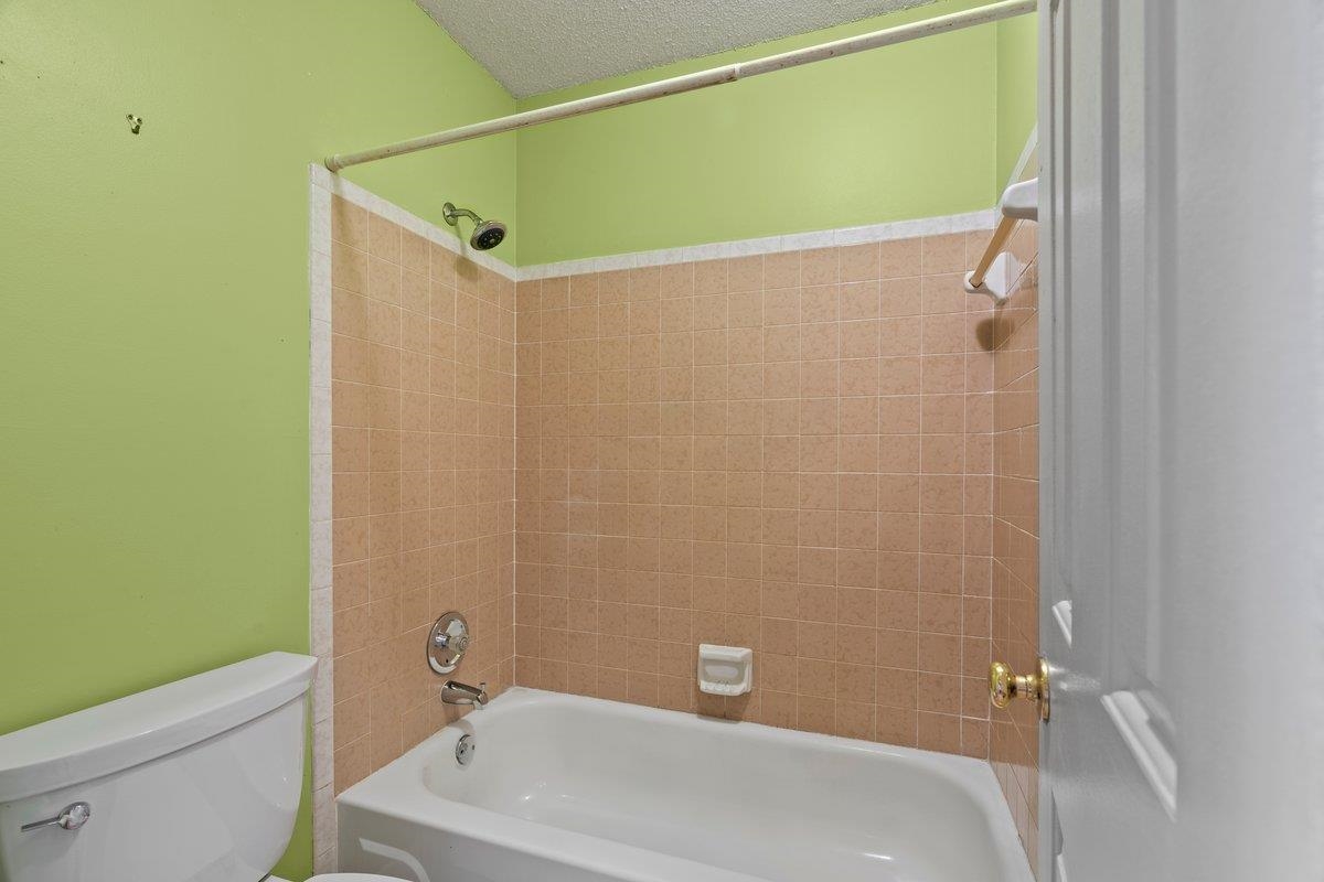 7008 Crestridge Road Memphis, TN 38119 - Photo 21 of 25 Bathroom with toilet and tub / shower combination