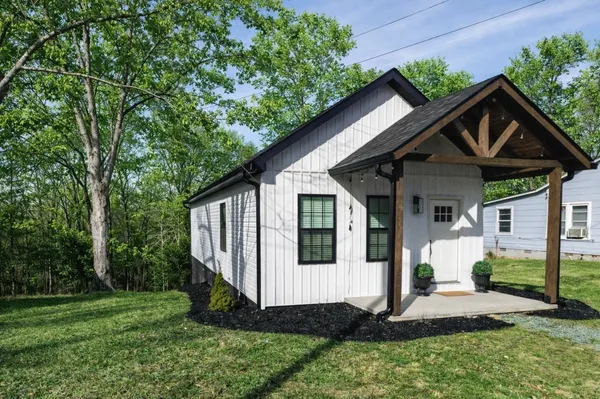 a front view of a house with a yard