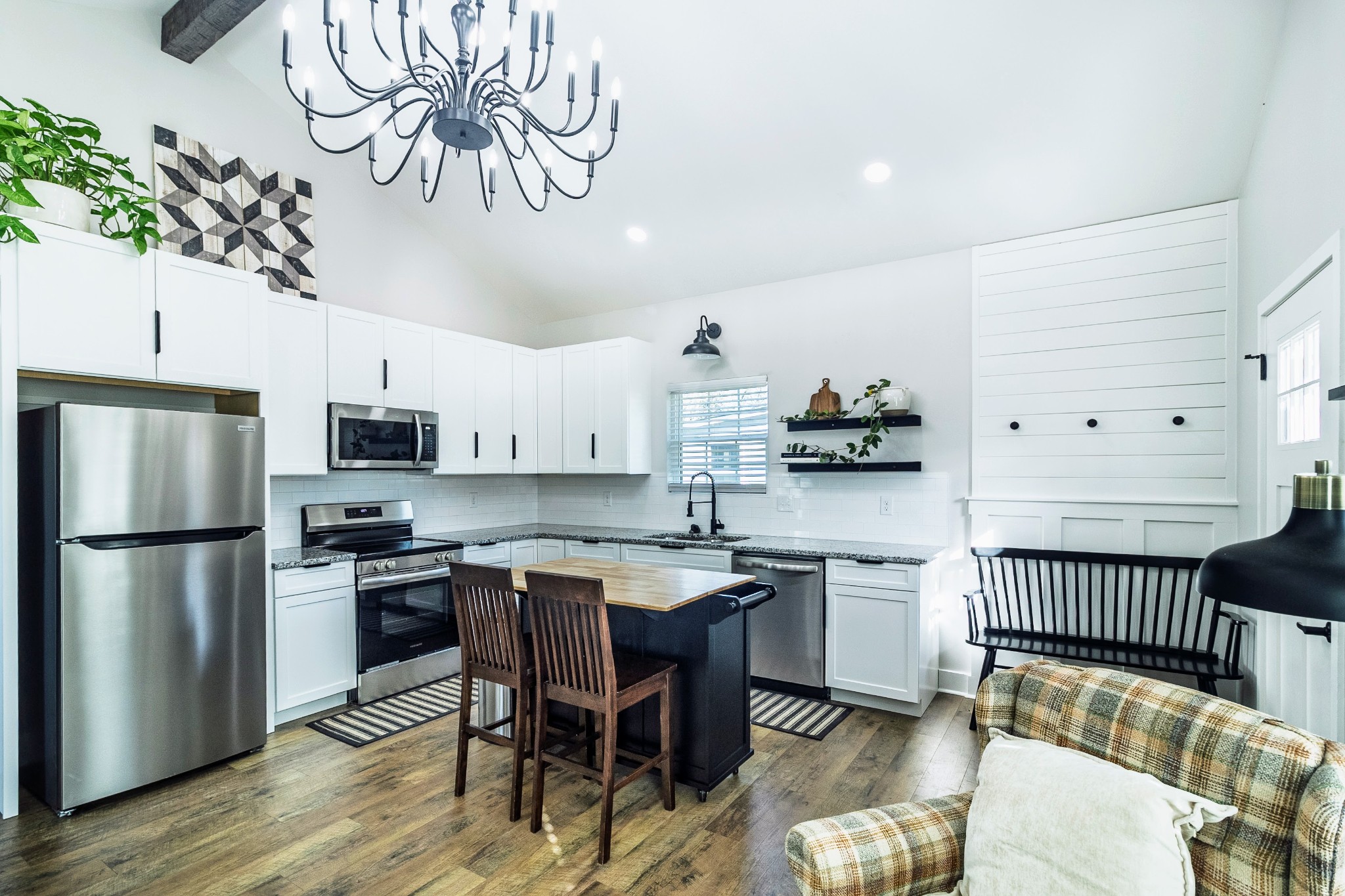 112 Wells Street Centerville, TN 37033 - Photo 3 of 22 a kitchen with stainless steel appliances granite countertop a sink and a refrigerator