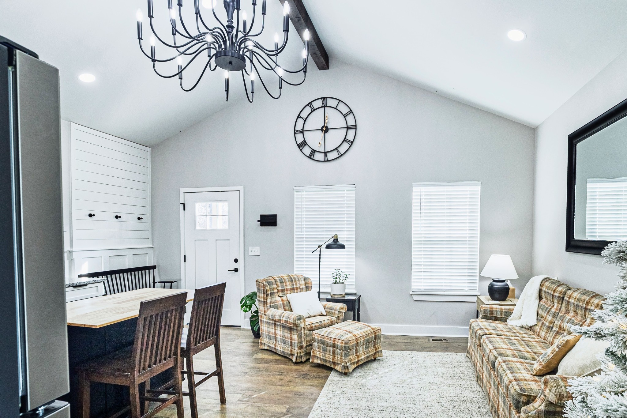 112 Wells Street Centerville, TN 37033 - Photo 4 of 22 a living room with furniture a rug and a chandelier